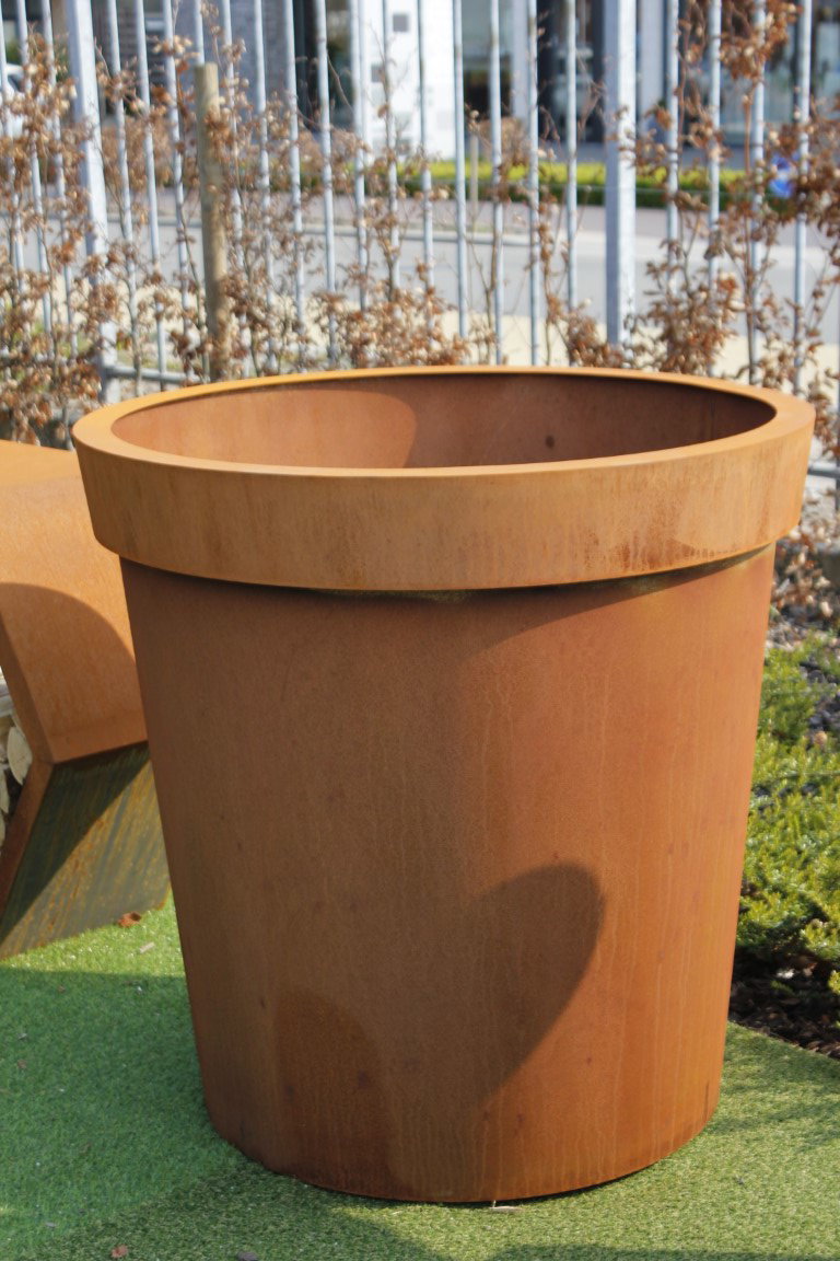 https://cdn.warentuin.nl/media/catalog/product/D/R/DROP5404033111088_01_geroba_plantenbakken_cortenstaal_vora_conische_plantenbakk_a2cb.JPG